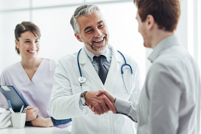 photo of doctor shaking patients hand